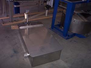 Stainless steel honey sump.